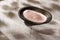 Fine pink Himalayan salt in a wooden bowl