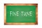 FINE  TUNE text written on green school board