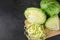 Finely chopped cabbage on a chopping board And cauliflower on black ground