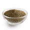 Finely ground black pepper in glass bowl.