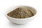 Finely ground black pepper in white ceramic bowl isolated on white.