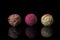 Finest chocolate truffle candies over black background.