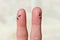 Finger art of couple. Couple after an argument looking in different directions