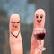 Finger art of couple. Woman is upset, man is drunk.