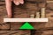 Finger Balancing Stacked Coins On Seesaw