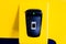 Finger biometric scanner with blurry finger on yellow machine