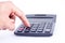 Finger hand put button calculator for calculating the numbers accounting accountancy business on white background isolated si