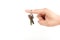 finger with hanging door key indicating direction.