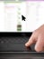 Finger moving mouse pointer on laptop touchpad