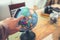 Finger point Globe, whole world.Travel , Adventure and Discovery concept