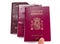 Finger pointint new spanish passport over old expired ones