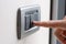 Finger pressing light switch