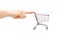 Finger pushing an empty shopping cart