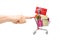 Finger pushing a shopping cart with presents