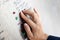 Finger reading braille tactile on public park message board