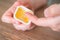 Finger in sauce. A man dips his finger into a cheese sauce. Harmful fast food, snack to eat