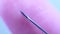 Finger touching medical syringe needle. Macro close up. Trypanophobia, extreme fear of injections or hypodermic needles.