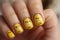 Fingernails with seasonal Easter nail art design with cute yellow Easter chicks