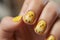 Fingernails with seasonal Easter nail art design with cute yellow Easter chicks and dots