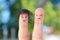 Fingers art of couple. This man is upset because he is bald