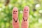 Fingers art of couple. Woman cries, man laughs