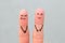 Fingers art of couple. Woman cries, man laughs