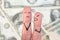 Fingers art of family during quarrel on background of money. wife shouts on husband
