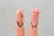 Fingers art of family during quarrel. wife shouts on husband, man laughs