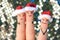 Fingers art of happy couple laughing in New Year hats. Woman is angry and jealous.