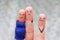 Fingers art of happy couple. Woman is pregnant. Other girl is jealous and angry