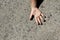Fingers art of people. Concept of group of people with different personalities. Childish hand on background of asphalt with