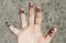 Fingers art of people. Concept of group of people with different personalities. Childish hand on background of asphalt with