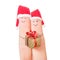 Fingers faces in Santa hats with gift box.