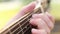 Fingers on guitar fretboard