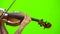 Fingers of the musician clamp the strings on the violin. Green screen. Close up