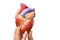 Fingers showing model human heart on white