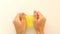 Fingers slowly squeeze and stretch the yellow mucus .SMR for stress relief