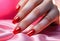Fingers of a young woman\\\'s hand with beautiful pearlescent nail polish, Creative manicure