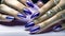 Fingers of a young woman\\\'s hand with beautiful pearlescent nail polish, Creative manicure