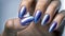 Fingers of a young woman\\\'s hand with beautiful pearlescent nail polish, Creative manicure