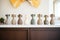 finished clay vases lined up on a shelf