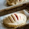 Finished production cookie in factory in the steel table. Production of biscuits, closeup. Working process. Private bakery.