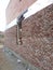 Finishing the facade of a private house under the brick