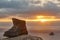 Finisterre Cape viewpoint at sunset with hiker boot mark