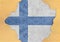 Finland flag in big concrete cracked hole and broken material facade