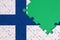 Finland flag is depicted on a completed jigsaw puzzle with free green copy space on the right side