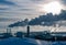 FINLAND, HELSINKI - JANUARY 20, 2015: Industry at Vuosaari harbor, smoke exiting chimneys is winter