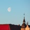 Finland, Helsinki, March 3, 2021.   Moon in the sky, Dawn, Spring panorama of Helsinki, a view of the Katajanokka and Krununhakka