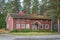 Finland, Hyrynsalmi, Kainuu region - August 27, 2018: Old authentic vintage wooden pharmacy building. The facade is lined with red