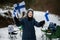 Finnish boy with Finland flags on a nice winter day. Nordic Scandinavian people